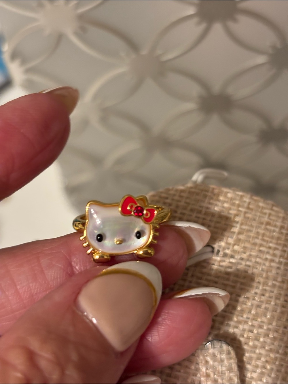 Hello Kitty Gold Tone Ring with White Enamel Face and Red Bow -